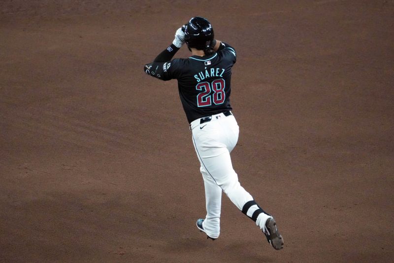 Aug 8, 2024; Phoenix, Arizona, USA; Arizona Diamondbacks third base Eugenio Suárez (28) runs the bases after hitting a solo home run against the Philadelphia Phillies during the fifth inning at Chase Field. Mandatory Credit: Joe Camporeale-USA TODAY Sports