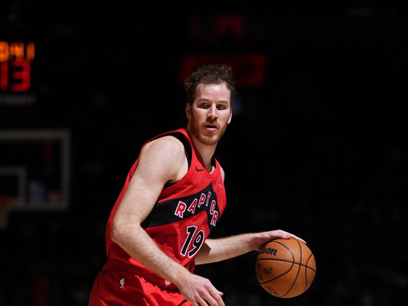 TORONTO, CANADA - OCTOBER 25: Jakob Poeltl #19 of the Toronto Raptors looks on during the game against the Philadelphia 76ers on October 25, 2024 at the Scotiabank Arena in Toronto, Ontario, Canada.  NOTE TO USER: User expressly acknowledges and agrees that, by downloading and or using this Photograph, user is consenting to the terms and conditions of the Getty Images License Agreement.  Mandatory Copyright Notice: Copyright 2024 NBAE (Photo by Mark Blinch/NBAE via Getty Images)