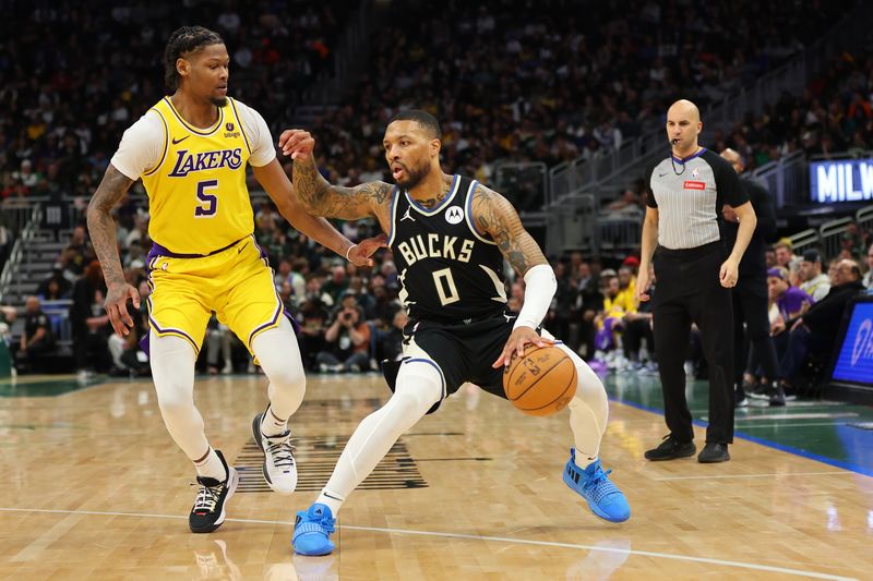 MILWAUKEE, WISCONSIN - MARCH 26: Damian Lillard #0 of the Milwaukee Bucks is defended by Cam Reddish #5 of the Los Angeles Lakers during the first half of a game at Fiserv Forum on March 26, 2024 in Milwaukee, Wisconsin. NOTE TO USER: User expressly acknowledges and agrees that, by downloading and or using this photograph, User is consenting to the terms and conditions of the Getty Images License Agreement. (Photo by Stacy Revere/Getty Images)