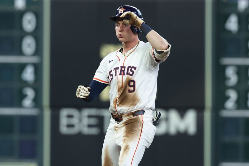 May 10, 2025; Houston, Texas, USA; Houston Astros left fielder Zach Dezenzo (9) reacts after hitting a double during the third inning against the Cincinnati Reds at Daikin Park. Mandatory Credit: Troy Taormina-Imagn Images