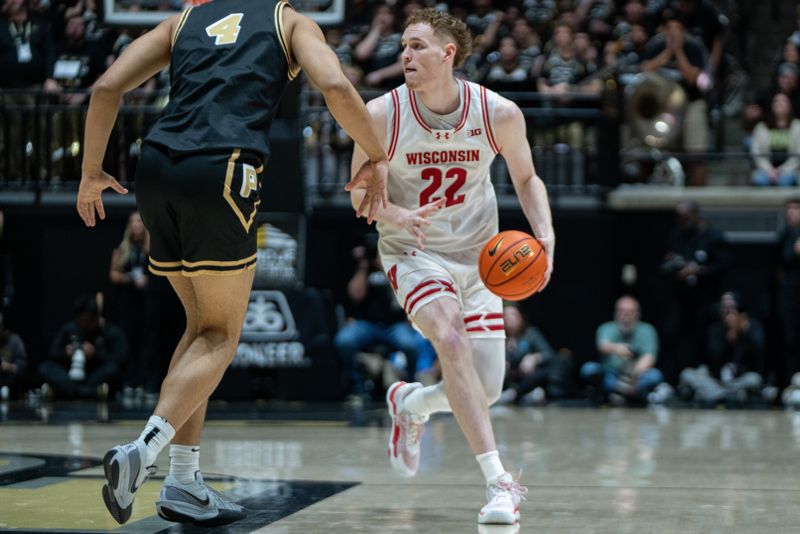 Mar 7, 2026; West Lafayette, Indiana, USA; Wisconsin Badgers forward Austin Rapp (22) dribbles the ball during the first half against the Purdue Boilermakers at Mackey Arena. Mandatory Credit: Jacob Musselman-Imagn Images