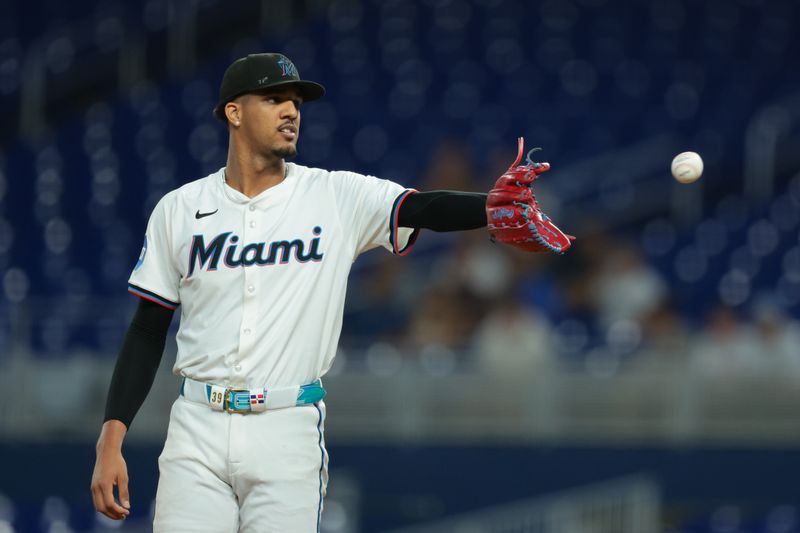 Sep 10, 2025; Miami, Florida, USA; Miami Marlins starting pitcher Eury Perez (39) catches a baseball against the Washington Nationals during the first inning at loanDepot Park. Mandatory Credit: Sam Navarro-Imagn Images