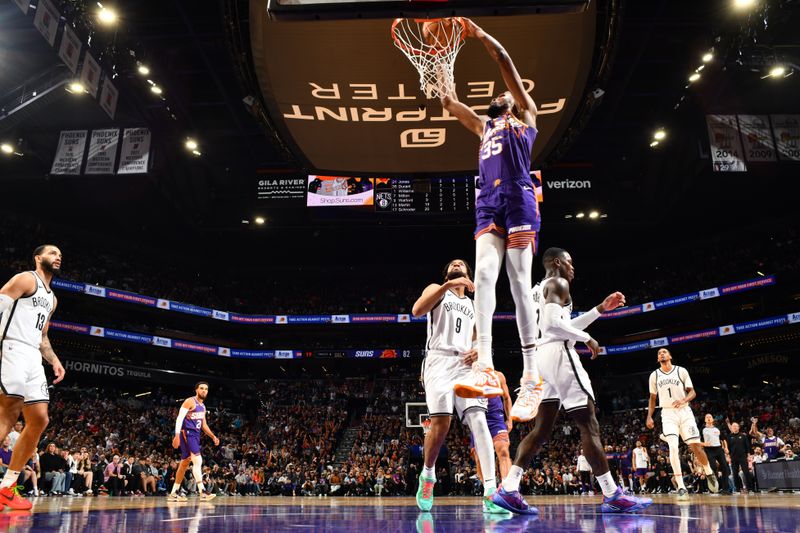 PHOENIX, AZ - NOVEMBER 27: Kevin Durant #35 of the Phoenix Suns dunks the ball during the game against the Brooklyn Nets on November 27, 2024 at Footprint Center in Phoenix, Arizona. NOTE TO USER: User expressly acknowledges and agrees that, by downloading and or using this photograph, user is consenting to the terms and conditions of the Getty Images License Agreement. Mandatory Copyright Notice: Copyright 2024 NBAE (Photo by Barry Gossage/NBAE via Getty Images)