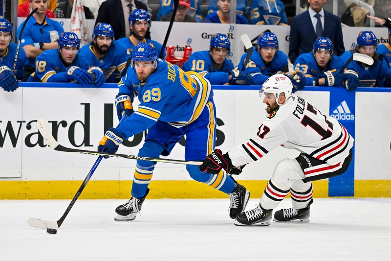 Dec 23, 2023; St. Louis, Missouri, USA;  St. Louis Blues left wing Pavel Buchnevich (89) and Chicago Blackhawks left wing Nick Foligno (17) battle for the puck during the first period at Enterprise Center. Mandatory Credit: Jeff Curry-USA TODAY Sports