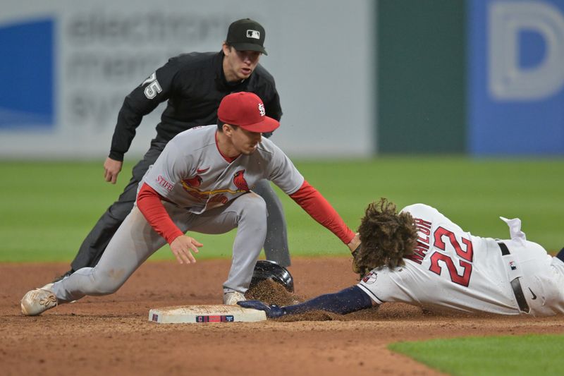 May 26, 2023; Cleveland, Ohio, USA; St. Louis Cardinals second baseman Tommy Edman (19) tags out Cleveland Guardians first baseman Josh Naylor (22) while trying to stretch a single into a double during the eighth inning at Progressive Field. Mandatory Credit: Ken Blaze-USA TODAY Sports