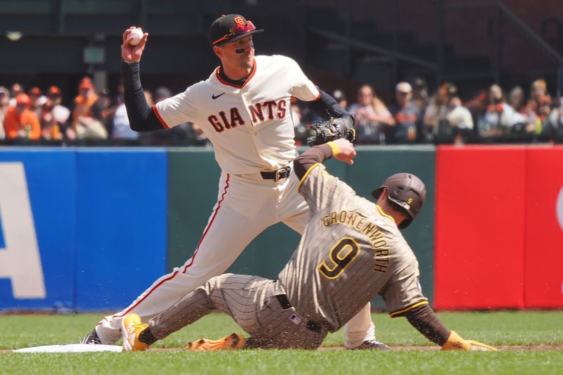 Apr 5, 2024; San Francisco, California, USA; San Francisco Giants shortstop Nick Ahmed (16) forces out San Diego Padres first baseman Jake Cronenworth (9) before completing a double play during the first inning at Oracle Park. Mandatory Credit: Kelley L Cox-USA TODAY Sports