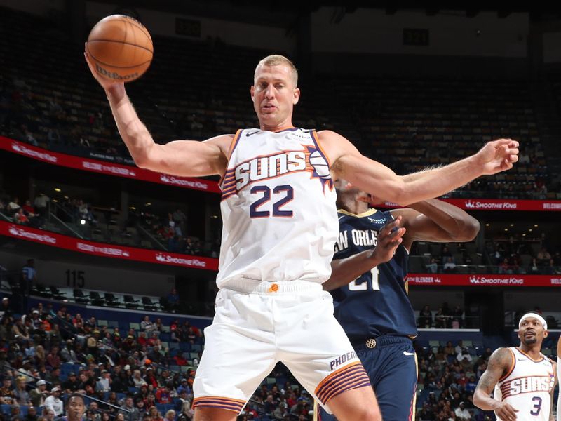 NEW ORLEANS, LA - DECEMBER 5: Mason Plumlee #22 of the Phoenix Suns grabs the rebound during the game against the New Orleans Pelicans on December 5, 2024 at the Smoothie King Center in New Orleans, Louisiana. NOTE TO USER: User expressly acknowledges and agrees that, by downloading and or using this Photograph, user is consenting to the terms and conditions of the Getty Images License Agreement. Mandatory Copyright Notice: Copyright 2024 NBAE (Photo by Layne Murdoch Jr./NBAE via Getty Images)