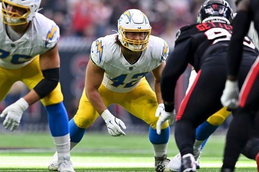 Los Angeles Chargers tight end Tucker Fisk (42) lines up against the Houston Texans during the first half of an NFL wild-card playoff football game, Saturday, Jan. 11, 2025, in Houston The Texans defeated the Chargers 32-12. (AP Photo/Maria Lysaker)