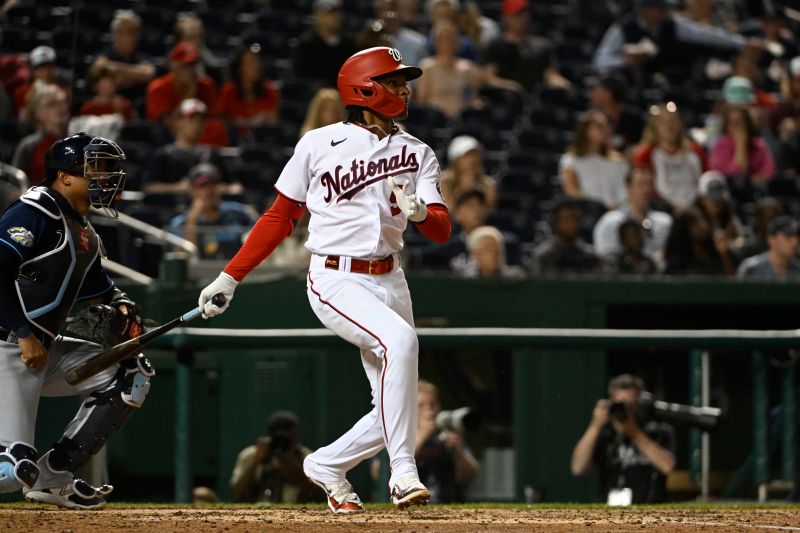 Apr 4, 2023; Washington, District of Columbia, USA; Washington Nationals shortstop CJ Abrams (5) singles against the Tampa Bay Rays during the fourth inning at Nationals Park. Mandatory Credit: Brad Mills-USA TODAY Sports