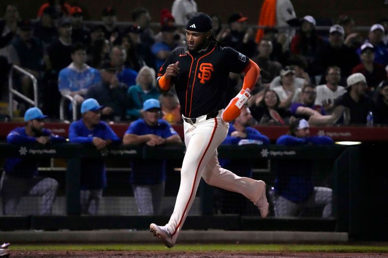 Mar 19, 2024; Scottsdale, Arizona, USA; San Francisco Giants center fielder Luis Matos (29) scores a run against the Kansas City Royals in the second inning at Scottsdale Stadium. Mandatory Credit: Rick Scuteri-USA TODAY Sports