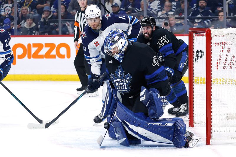 Oct 28, 2024; Winnipeg, Manitoba, CAN; Winnipeg Jets forward Gabriel Vilardi (13) looks for a rebound from Toronto Maple Leafs goalie Anthony Stolarz (41) during the second period at Canada Life Centre. Mandatory Credit: Terrence Lee-Imagn Images