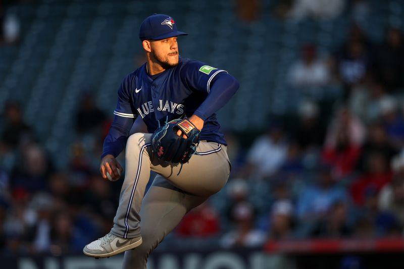 May 7, 2025; Anaheim, California, USA;  Toronto Blue Jays starting pitcher Jose Berrios (17) pitches during the second inning against the Los Angeles Angels at Angel Stadium. Mandatory Credit: Kiyoshi Mio-Imagn Images