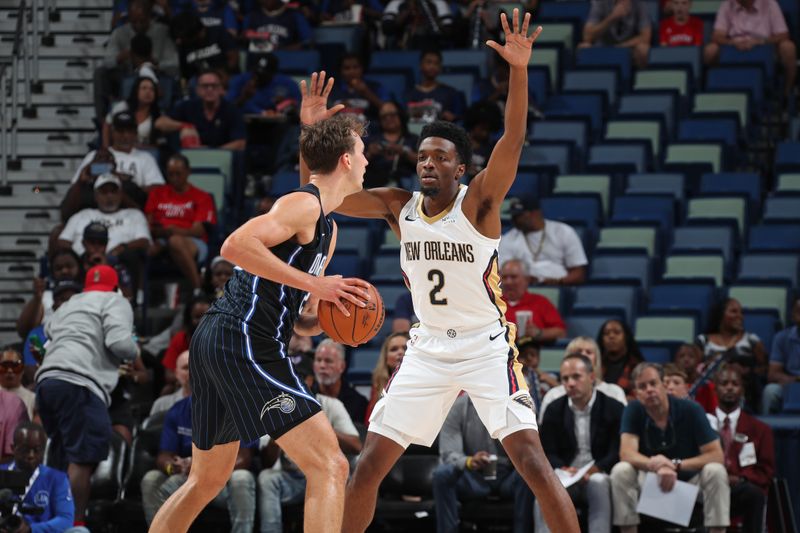 NEW ORLEANS, LA - OCTOBER 7: Herb Jones #2 of the New Orleans Pelicans plays defense against the Orlando Magic on October 7, 2024 at the Smoothie King Center in New Orleans, Louisiana. NOTE TO USER: User expressly acknowledges and agrees that, by downloading and or using this Photograph, user is consenting to the terms and conditions of the Getty Images License Agreement. Mandatory Copyright Notice: Copyright 2024 NBAE (Photo by Layne Murdoch Jr./NBAE via Getty Images)