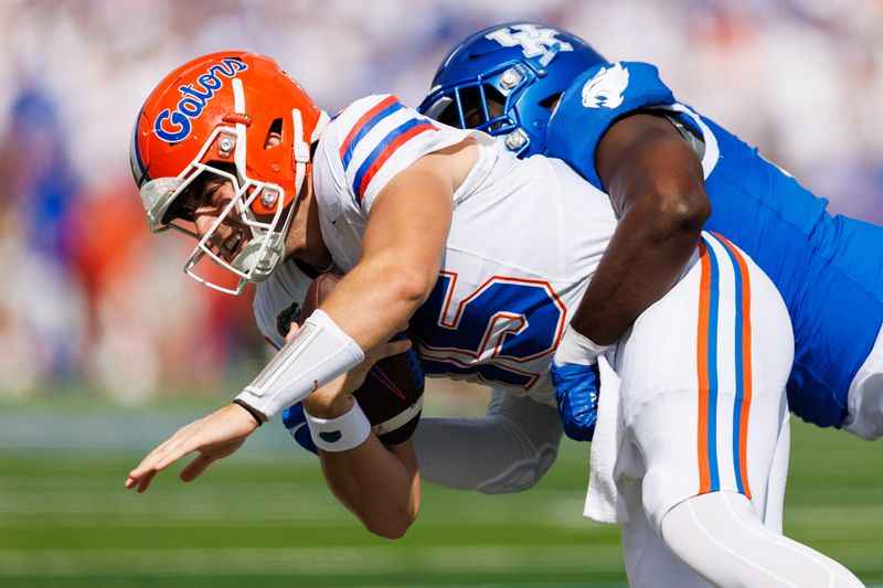 Sep 30, 2023; Lexington, Kentucky, USA; Florida Gators quarterback Graham Mertz (15) is tackled by Kentucky Wildcats linebacker D'Eryk Jackson (54) during the first quarter at Kroger Field. Mandatory Credit: Jordan Prather-USA TODAY Sports