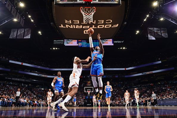 PHOENIX, AZ - NOVEMBER 12: Luguentz Dort #5 of the Oklahoma City Thunder drives to the basket during the game against the Phoenix Suns on November 12, 2023 at Footprint Center in Phoenix, Arizona. NOTE TO USER: User expressly acknowledges and agrees that, by downloading and or using this photograph, user is consenting to the terms and conditions of the Getty Images License Agreement. Mandatory Copyright Notice: Copyright 2023 NBAE (Photo by Barry Gossage/NBAE via Getty Images)