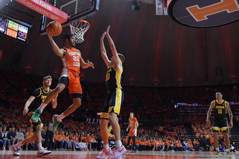 Feb 24, 2024; Champaign, Illinois, USA;  Illinois Fighting Illini forward Ty Rodgers (20) looks to pass the ball as Iowa Hawkeyes forward Payton Sandfort (20) defends during the first half at State Farm Center. Mandatory Credit: Ron Johnson-USA TODAY Sports