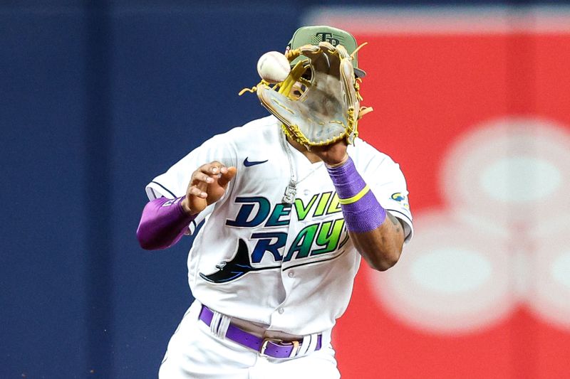 May 19, 2023; St. Petersburg, Florida, USA;  Tampa Bay Rays shortstop Wander Franco (5) fields the ball for a an out against the Milwaukee Brewers in the sixth inning at Tropicana Field. Mandatory Credit: Nathan Ray Seebeck-USA TODAY Sports