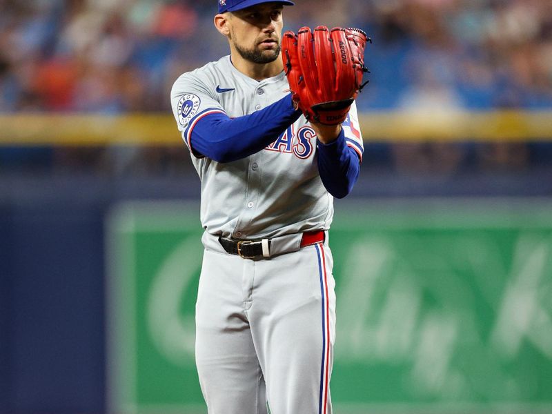 Apr 3, 2024; St. Petersburg, Florida, USA;  Texas Rangers starting pitcher Nathan Eovaldi (17) throws a pitch against the Tampa Bay Rays in the first inning at Tropicana Field. Mandatory Credit: Nathan Ray Seebeck-USA TODAY Sports