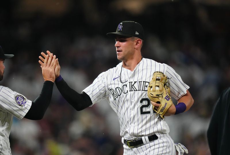 Jul 14, 2023; Denver, Colorado, USA; Colorado Rockies first baseman Nolan Jones (22) celebrates defeating the New York Yankees at Coors Field. Mandatory Credit: Ron Chenoy-USA TODAY Sports