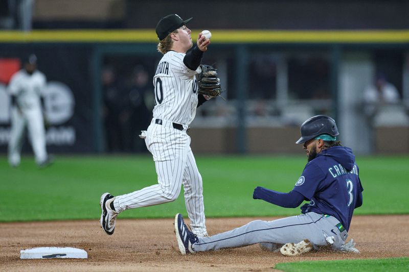 May 20, 2025; Chicago, Illinois, USA; Chicago White Sox shortstop Chase Meidroth (10) throws out Seattle Mariners shortstop J.P. Crawford (3) at second base during the first inning at Rate Field. Mandatory Credit: Kamil Krzaczynski-Imagn Images