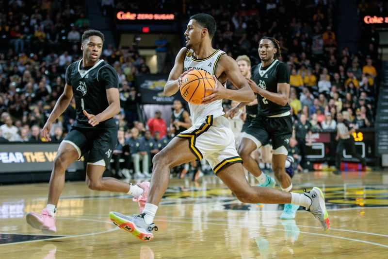 Mar 2, 2024; Wichita, Kansas, USA; Wichita State Shockers guard Harlond Beverly (20) drives to the basket during the first half against the Rice Owls at Charles Koch Arena. Mandatory Credit: William Purnell-USA TODAY Sports