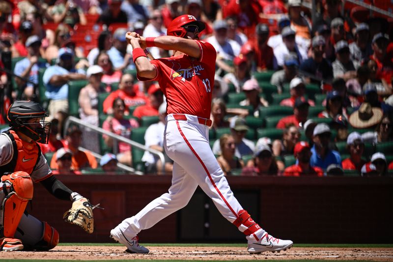 Jun 23, 2024; St. Louis, Missouri, USA; St. Louis Cardinals designated hitter Matt Carpenter (13) hits an RBI single against the San Francisco Giants in the first inning at Busch Stadium. Mandatory Credit: Joe Puetz-USA TODAY Sports