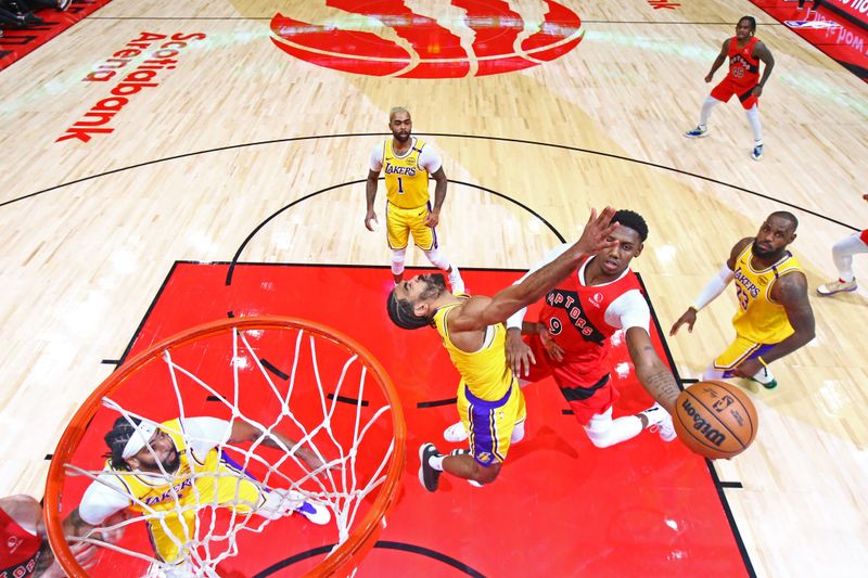 TORONTO, CANADA - NOVEMBER 1: RJ Barrett #9 of the Toronto Raptors drives to the basket during the game against the Los Angeles Lakers on November 1, 2024 at the Scotiabank Arena in Toronto, Ontario, Canada.  NOTE TO USER: User expressly acknowledges and agrees that, by downloading and or using this Photograph, user is consenting to the terms and conditions of the Getty Images License Agreement.  Mandatory Copyright Notice: Copyright 2024 NBAE (Photo by Vaughn Ridley/NBAE via Getty Images)