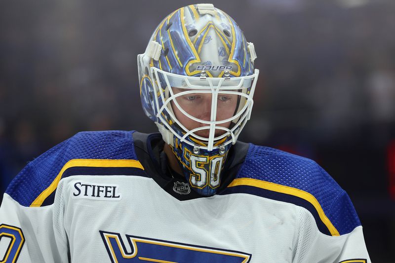 Dec 19, 2023; Tampa, Florida, USA; St. Louis Blues goaltender Jordan Binnington (50) looks on against the Tampa Bay Lightning during the first period at Amalie Arena. Mandatory Credit: Kim Klement Neitzel-USA TODAY Sports