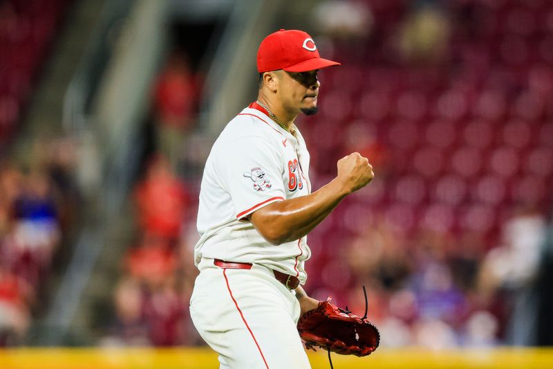 Aug 14, 2024; Cincinnati, Ohio, USA; Cincinnati Reds relief pitcher Fernando Cruz (63) reacts after the victory over the St. Louis Cardinals at Great American Ball Park. Mandatory Credit: Katie Stratman-USA TODAY Sports