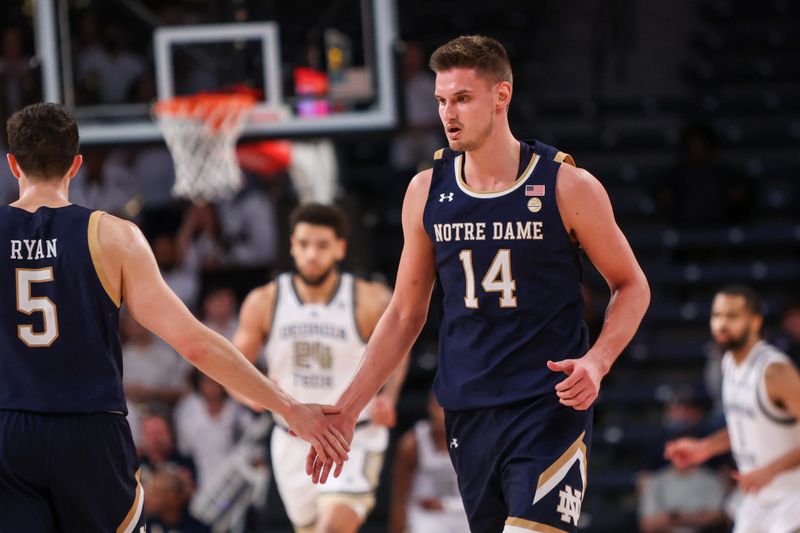 Feb 8, 2023; Atlanta, Georgia, USA; Notre Dame Fighting Irish forward Nate Laszewski (14) celebrates after a basket with Notre Dame Fighting Irish guard Cormac Ryan (5) against the Georgia Tech Yellow Jackets in the second half at McCamish Pavilion. Mandatory Credit: Brett Davis-USA TODAY Sports