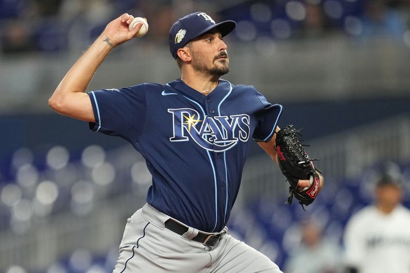 Aug 30, 2023; Miami, Florida, USA; Tampa Bay Rays starting pitcher Zach Eflin (24) pitches against the Miami Marlins in the first inning at loanDepot Park. Mandatory Credit: Jim Rassol-USA TODAY Sports