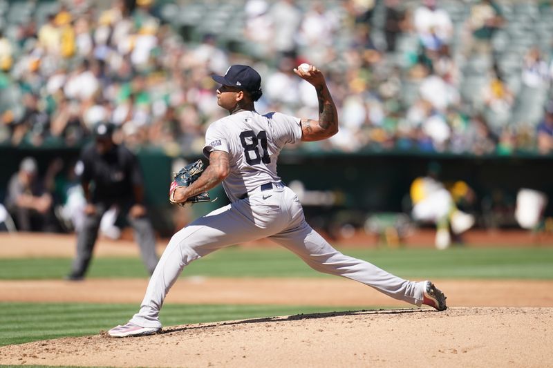 Sep 22, 2024; Oakland, California, USA; New York Yankees pitcher Luis Gil (81) delivers a pitch against the Oakland Athletics in the third inning at the Oakland-Alameda County Coliseum. Mandatory Credit: Cary Edmondson-Imagn Images