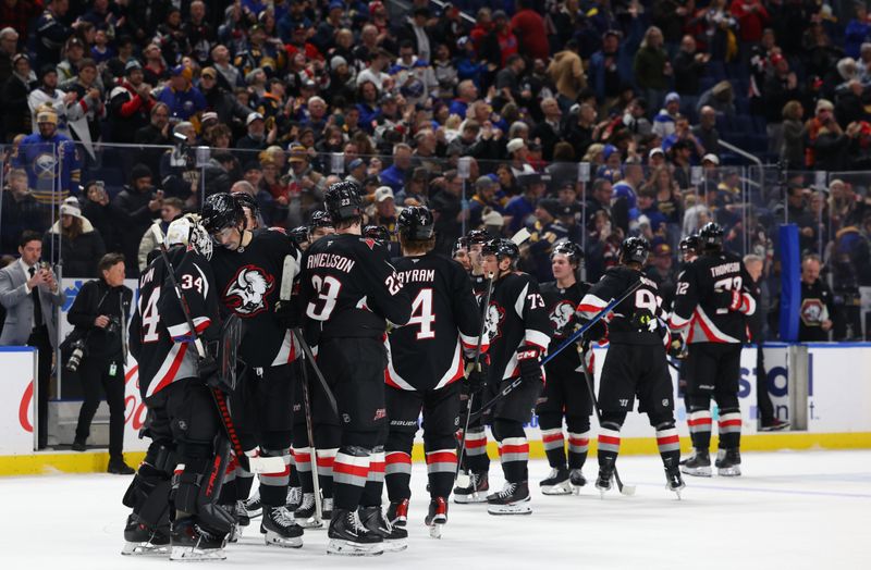 Jan 29, 2026; Buffalo, New York, USA;  The Buffalo Sabres celebrate a win over the Los Angeles Kings at KeyBank Center. Mandatory Credit: Timothy T. Ludwig-Imagn Images