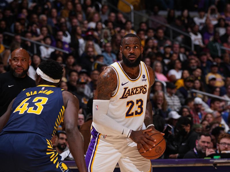 LOS ANGELES, CA - MARCH 24: LeBron James #23 of the Los Angeles Lakers handles the ball during the game against the Indiana Pacers on March 24, 2024 at Crypto.Com Arena in Los Angeles, California. NOTE TO USER: User expressly acknowledges and agrees that, by downloading and/or using this Photograph, user is consenting to the terms and conditions of the Getty Images License Agreement. Mandatory Copyright Notice: Copyright 2024 NBAE (Photo by Garrett Ellwood/NBAE via Getty Images)