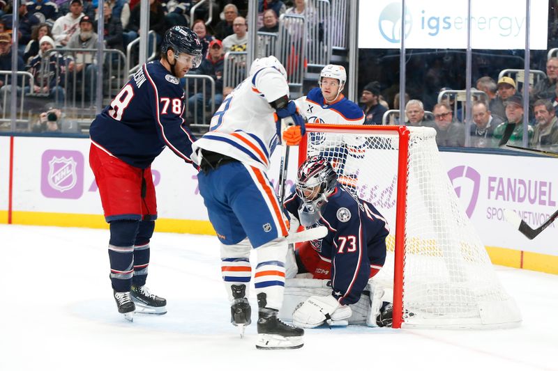 Nov 13, 2025; Columbus, Ohio, USA; Columbus Blue Jackets goalie Jet Greaves (73) makes a save as Edmonton Oilers center Adam Henrique (19) looks for a rebound during the first period at Nationwide Arena. Mandatory Credit: Russell LaBounty-Imagn Images