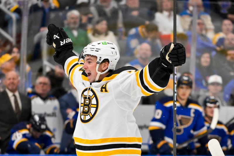 Nov 12, 2024; St. Louis, Missouri, USA;  Boston Bruins defenseman Charlie McAvoy (73) reacts after scoring the game tying goal against the St. Louis Blues during the third period at Enterprise Center. Mandatory Credit: Jeff Curry-Imagn Images
