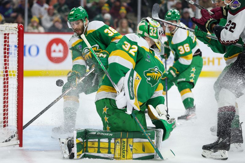 Jan 13, 2024; Saint Paul, Minnesota, USA; Minnesota Wild goaltender Filip Gustavsson (32) makes a save against the Arizona Coyotes during the first period at Xcel Energy Center. Mandatory Credit: Matt Krohn-USA TODAY Sports