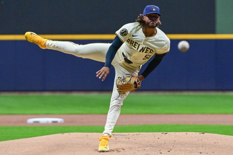 Apr 5, 2024; Milwaukee, Wisconsin, USA; Milwaukee Brewers pitcher Freddy Peralta (51) throws a pitch in the first inning against the Seattle Mariners at American Family Field. Mandatory Credit: Benny Sieu-USA TODAY Sports