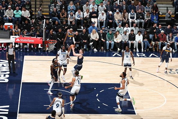 MINNEAPOLIS, MN -  NOVEMBER 1: Christian Braun #0 of the Denver Nuggets drives to the basket during the game against the Minnesota Timberwolves on November 1, 2023 at Target Center in Minneapolis, Minnesota. NOTE TO USER: User expressly acknowledges and agrees that, by downloading and or using this Photograph, user is consenting to the terms and conditions of the Getty Images License Agreement. Mandatory Copyright Notice: Copyright 2023 NBAE (Photo by David Sherman/NBAE via Getty Images)