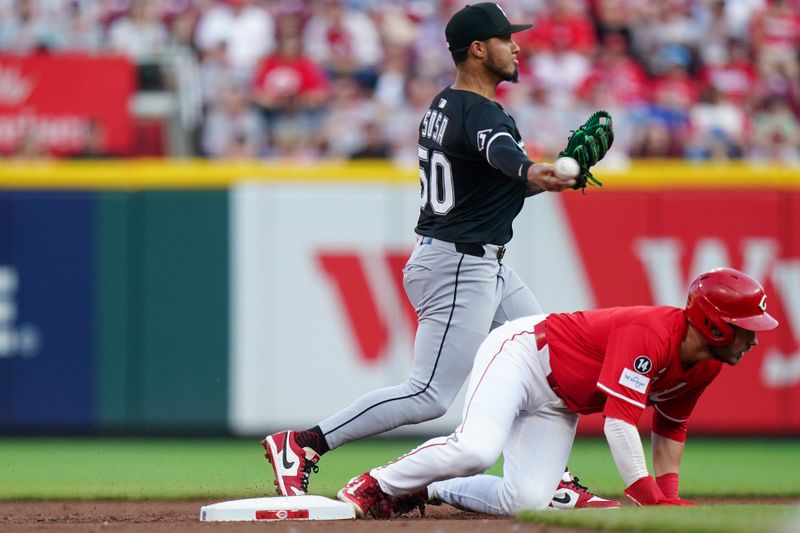 May 14, 2025; Cincinnati, Ohio, USA; Chicago White Sox second baseman Lenyn Sosa (50) throws the ball to first base after tagging out Cincinnati Reds outfielder Gavin Lux (2) in the first inning of the MLB interleague game between the Cincinnati Reds and Chicago White Sox. Mandatory Credit: Frank Bowen IV-Imagn Images