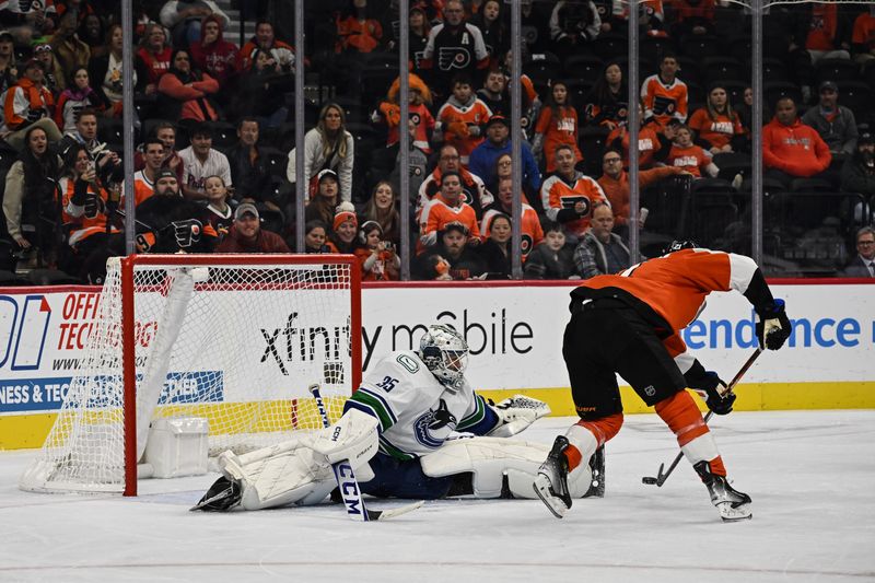 Oct 17, 2023; Philadelphia, Pennsylvania, USA; Vancouver Canucks goaltender Thatcher Demko (35) makes a save on Philadelphia Flyers center Scott Laughton (21) in the third period at the Wells Fargo Center. The Flyers won 2-0. Mandatory Credit: John Geliebter-USA TODAY Sports