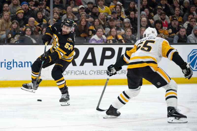Jan 11, 2026; Boston, Massachusetts, USA; Boston Bruins center Sean Kuraly (52) shoots the puck during the third period of the game against the Pittsburgh Penguins at TD Garden. Mandatory Credit: Natalie Reid-Imagn Images