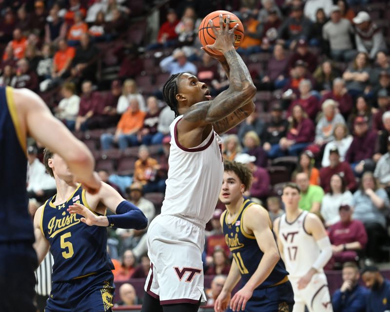 Jan 17, 2026; Blacksburg, Virginia, USA;  Virginia Tech Hokies forward Tobi Lawal (1) goes up for a shot against Notre Dame Fighting Irish during the first half at Cassell Coliseum. Mandatory Credit: Brian Bishop-Imagn Images
