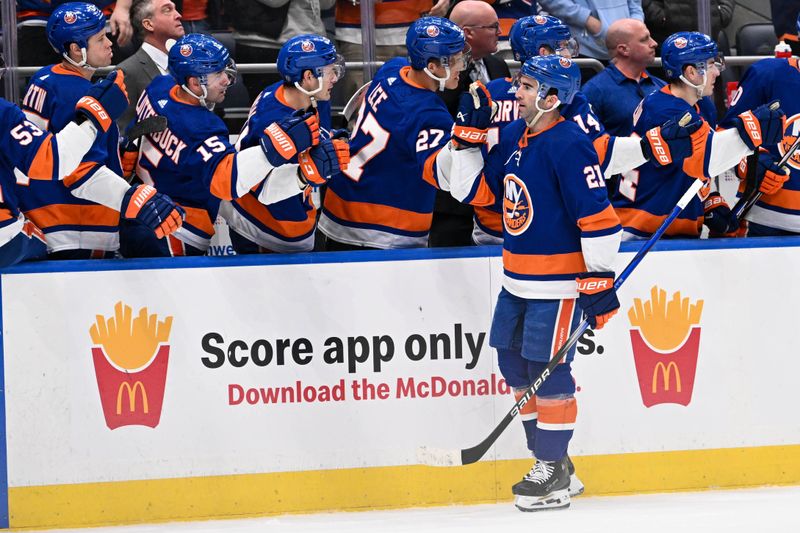 Feb 8, 2024; Elmont, New York, USA; New York Islanders center Kyle Palmieri (21) celebrates his goal against the Tampa Bay Lightning with the New York Islanders bench during the first period at UBS Arena. Mandatory Credit: Dennis Schneidler-USA TODAY Sports