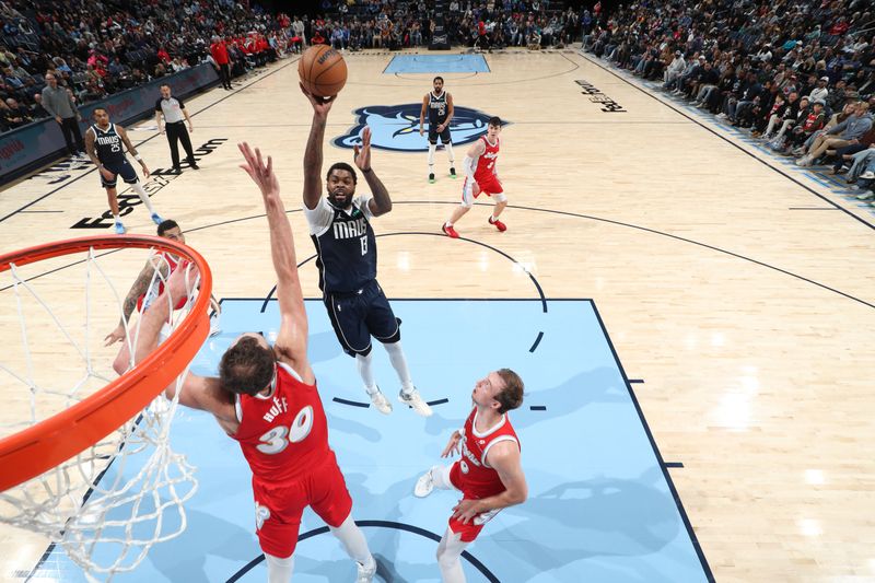 MEMPHIS, TN - JANUARY 6:   Naji Marshall #13 of the Dallas Mavericks drives to the basket during the game against the Memphis Grizzlies on January  6, 2024 at FedExForum in Memphis, Tennessee. NOTE TO USER: User expressly acknowledges and agrees that, by downloading and or using this photograph, User is consenting to the terms and conditions of the Getty Images License Agreement. Mandatory Copyright Notice: Copyright 2024 NBAE (Photo by Joe Murphy/NBAE via Getty Images)