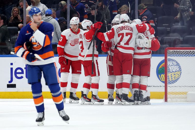 Oct 22, 2024; Elmont, New York, USA; Detroit Red Wings players celebrate after defeating the New York Islanders at UBS Arena. Mandatory Credit: Brad Penner-Imagn Images