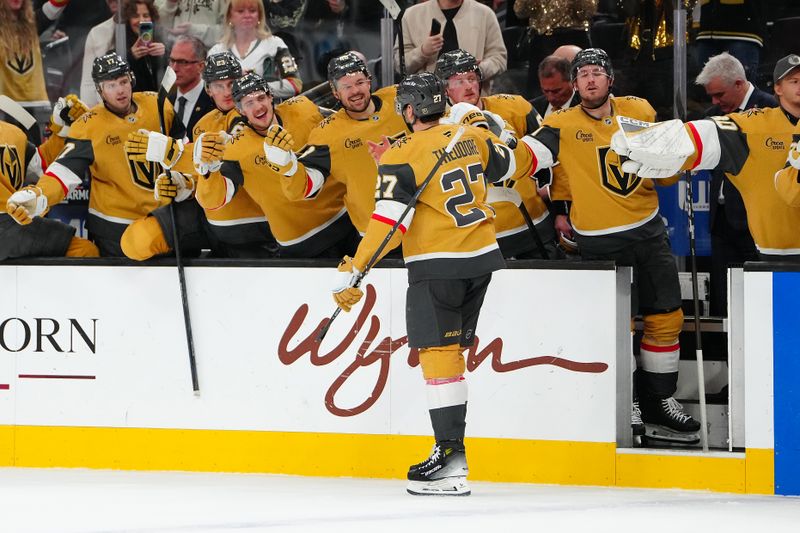 Jan 10, 2026; Las Vegas, Nevada, USA; Vegas Golden Knights defenseman Shea Theodore (27) celebrates with team mates after scoring a goal against the St. Louis Blues during the second period at T-Mobile Arena. Mandatory Credit: Stephen R. Sylvanie-Imagn Images
