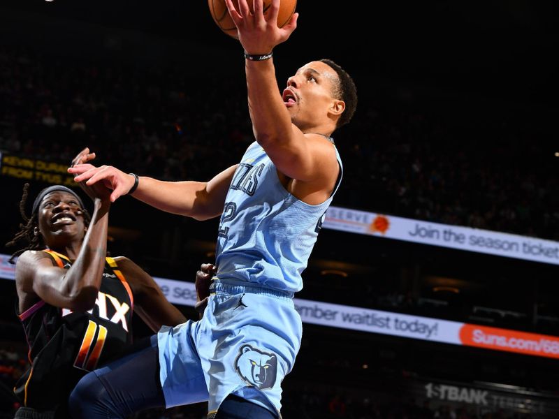 PHOENIX, AZ - FEBRUARY 11:  Desmond Bane #22 of the Memphis Grizzlies drives to the basket during the game against the Phoenix Suns on February 11, 2025 at Footprint Center in Phoenix, Arizona. NOTE TO USER: User expressly acknowledges and agrees that, by downloading and or using this photograph, user is consenting to the terms and conditions of the Getty Images License Agreement. Mandatory Copyright Notice: Copyright 2025 NBAE (Photo by Barry Gossage/NBAE via Getty Images)