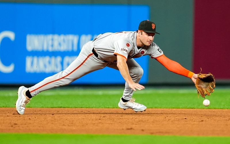 Sep 20, 2024; Kansas City, Missouri, USA; San Francisco Giants third baseman Casey Schmitt (10) dives for a ground ball during the fifth inning against the Kansas City Royals at Kauffman Stadium. Mandatory Credit: Jay Biggerstaff-Imagn Images