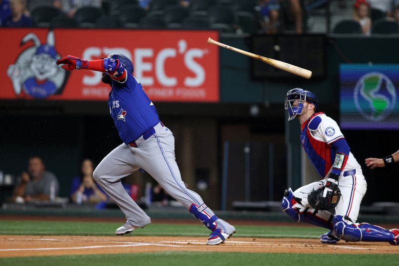 May 26, 2025; Arlington, Texas, USA; Toronto Blue Jays designated hitter Vladimir Guerrero Jr. (27) tosses his bat after hitting the ball during the first inning against the Texas Rangers at Globe Life Field. Mandatory Credit: Tim Heitman-Imagn Images